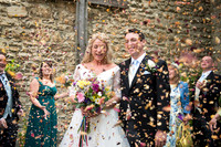 elizabeth donovan photography  bride and groom covered in pretty  confetti wiltshire