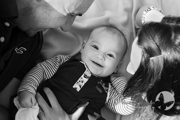 looking down at baby on a blanket relaxed outdoor family portrait in wiltshire elizabeth donovan photography cute family