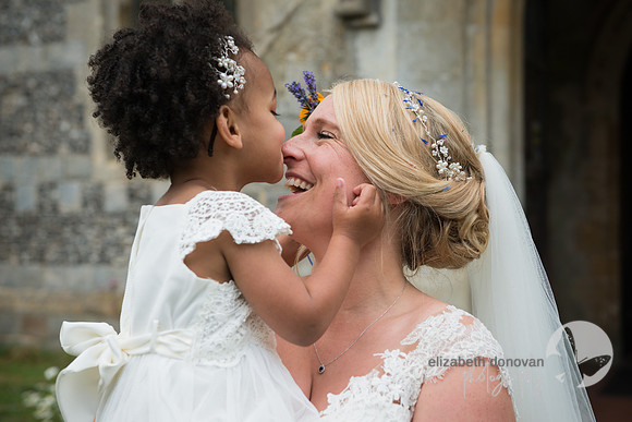 bride with her cute niece bridesmaid elizabeth donovan photography