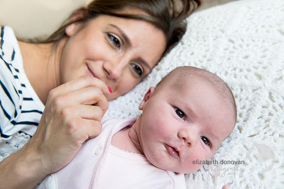 mother and baby resting together Baby photo shoot in the home natural photography with little one family lifestyle swindon wiltshire