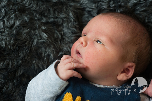 cute little boy on soft grey blanket Baby photo shoot in the home natural photography with little one family lifestyle swindon wiltshire