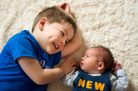 brothers together Baby photo shoot in the home natural photography with little one family lifestyle swindon wiltshire