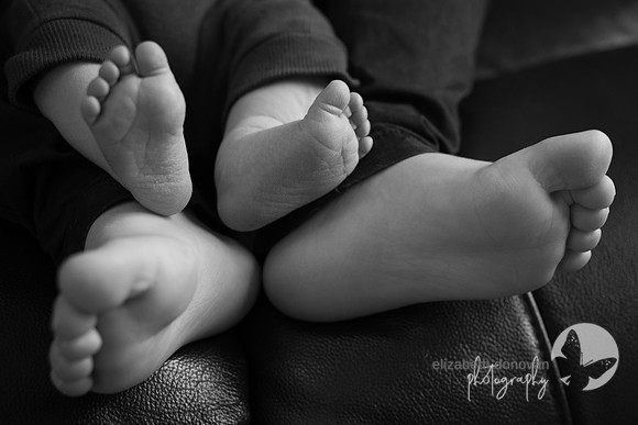little toes baby and brother sitting together Baby photo shoot in the home natural photography with little one family lifestyle swindon wiltshire