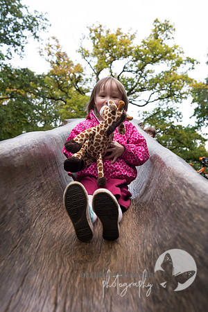 sweet girl having fun relaxed outdoor family portrait in swindon elizabeth donovan photography cute children portrait