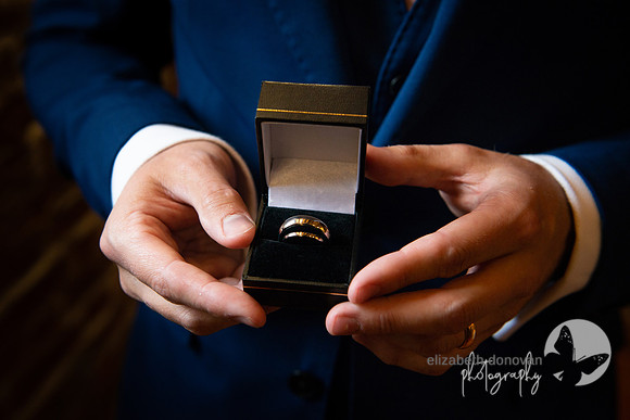 wedding rings held by the best man at wellington barn elizabeth donovan photography