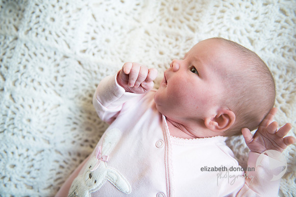 cute little girl on crochet blanket Baby photo shoot in the home natural photography with little one family lifestyle swindon wiltshire
