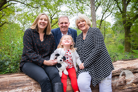family photo in the forest, mum and daughter with grandparents elizabeth donovan photography outdoor photo shoot in the trees autumn