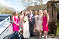 bride with her dad and bridesmaids wearing pink elizabeth donovan photography