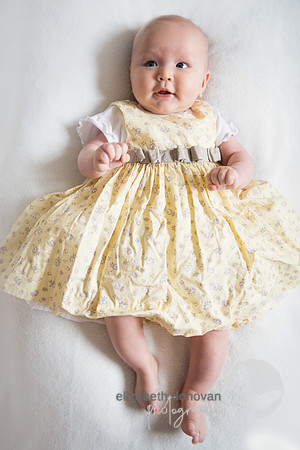 sweet little girl in cute yellow dress Baby photo shoot in the home natural photography with little one family lifestyle swindon wiltshire
