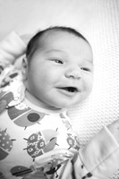 smiling 2 week old baby girl Baby photo shoot in the home natural photography with little one family lifestyle swindon wiltshire
