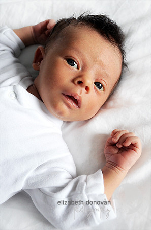 sweet baby boy dressed in white Baby photo shoot in the home natural photography with little one family lifestyle swindon wiltshire